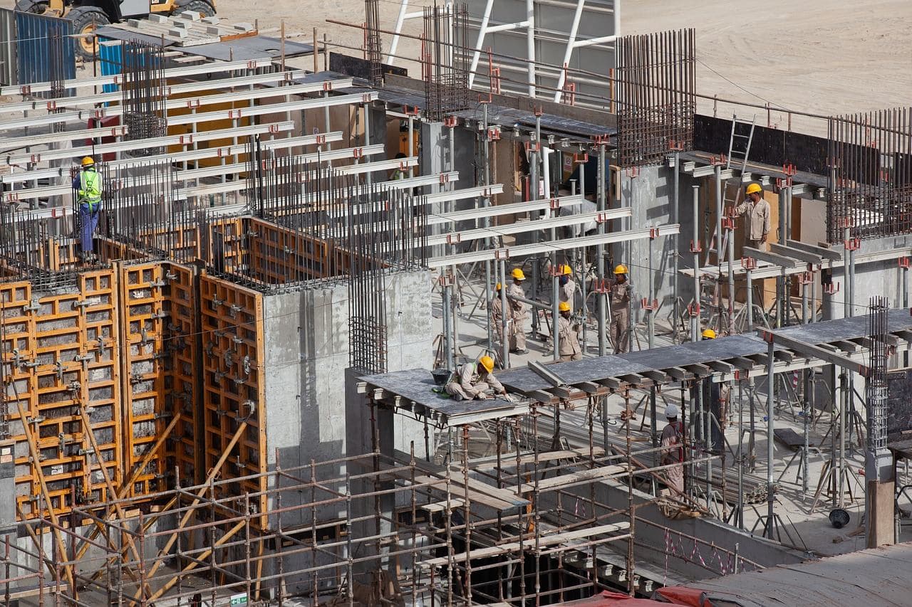 Workers on the structure under construction